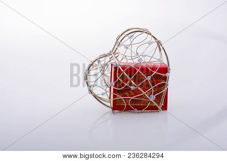 The Holy Quran In Mini Size In A Heart Shaped Cage