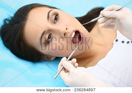 Young Female Patient Visiting Dentist Office.beautiful Woman With Healthy Straight White Teeth Sitti