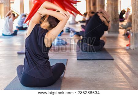 Back Sode Of Group Of People Gathering To Practic Yoga At A Commuinity Place, For Healthy Lifestyle
