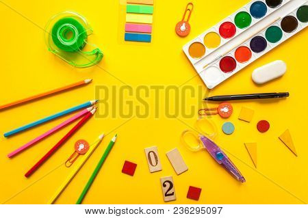 Round Frame With Stationery On The Yellowbackground. Multicolor Pencils And Paints. Place For Your T