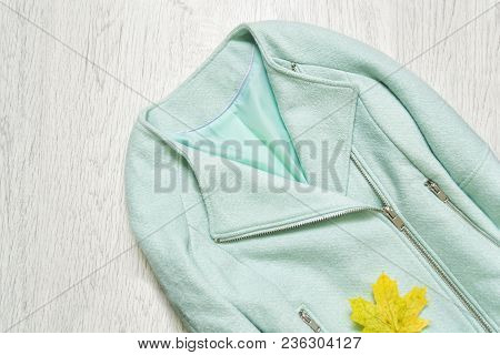 Mint Jacket And Maple Leaf. Fashionable Concept