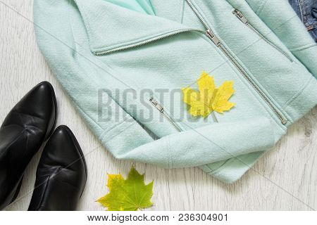 Mint Jacket, Black Shoes And Maple Leaves. Fashionable Concept
