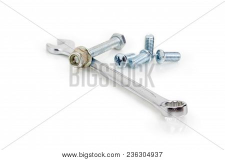Chrome-plated Combination Wrench Open At One End And Ring At The Other Among Of Bolts, Screws, Nuts 