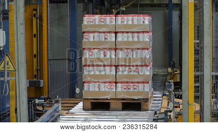 Moscow, Russia - May, 2017: Packed Box On Production Line. Clip. Cardboard Boxes On Conveyor Belt In