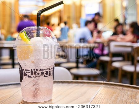 Cold Drink Of Lychee Lamon Juices With Soda And Ice On The Table In The Restaurant (seclective Focus