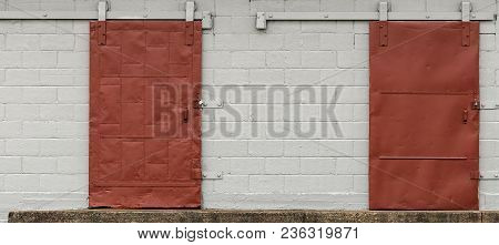 Old Red Sliding Dock Door On Rollers And Rail.