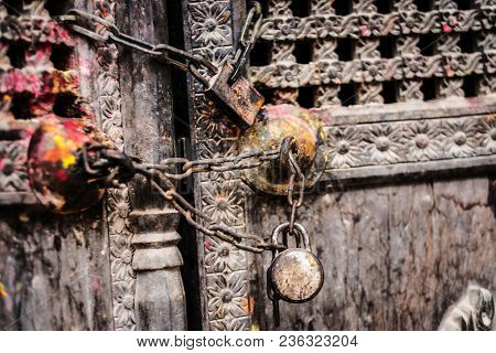 Ttraditional Nepalese wooden door with chain and locks