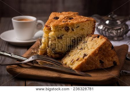 Cup Of Coffee And Slices Of Home Made Cake With Raisins On Wooden Plate,vintage Style