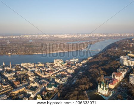 Kiev, Ukraine - April 7, 2018: Panoramic view of the Dnieper River pedestrian bridge, Trukhanov Island and Andreevskaya church .