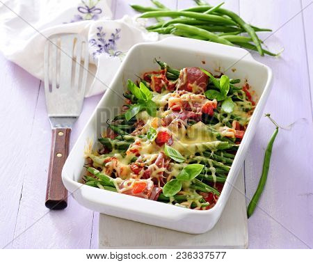 Green Bean, Ham  And Vegetable Casserole Topped With Cheese.