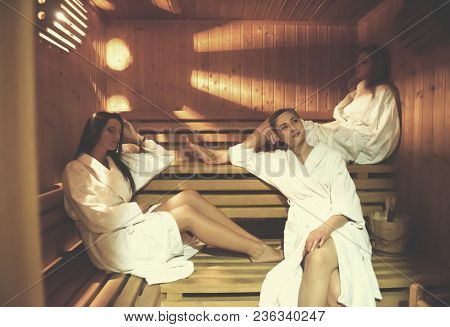 three female friends in sauna, woman group have fun and celebrate bachelorette pary in spa wellness salon