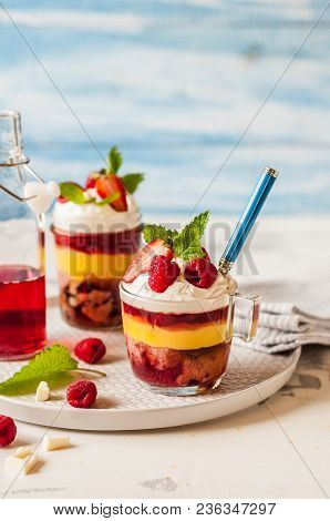 Fruit Cake, Jelly, Custard, Berry And White Cocolate Whipped Cream Individual Trifles, Copy Space Fo