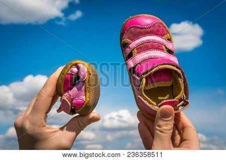 Woman Is Holding Barefoot Shoes With Flexible Sole