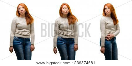 Young Beautiful redhead woman making funny face fooling