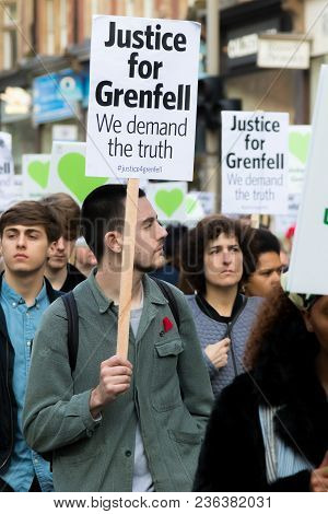 London, United Kingdom, 14th April 2018:- Marchers On A Silent March From Kensington Town Hall To Th
