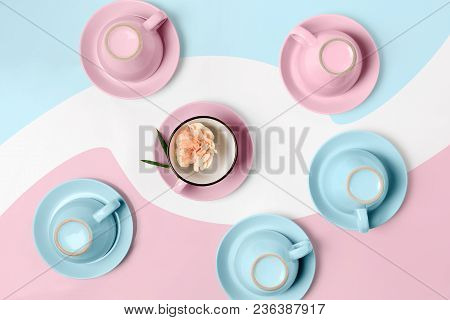 Overturned Coffee Or Tea Set. Plenty Of Elegant Porcelain Light Blue And Pastel Pink Cups Bottoms An
