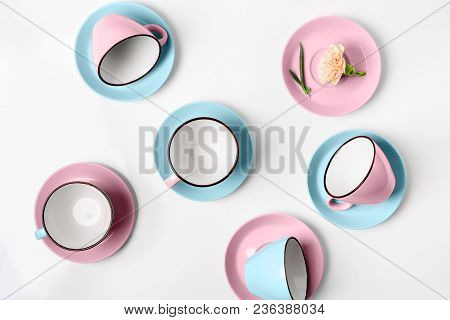 Clean Coffee Or Tea Set. Plenty Of Elegant Porcelain Light Blue Saucers And Pastel Pink Cups And At 
