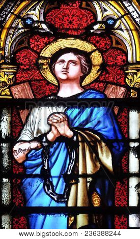 PARIS, FRANCE - JANUARY 05: Saint Agatha of Sicily, stained glass window in the Basilica of Saint Clotilde in Paris, France on January 05, 2018.