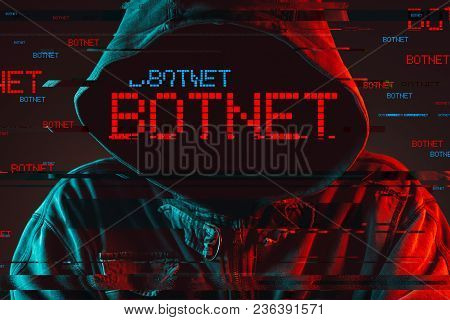 Botnet Concept With Faceless Hooded Male Person, Low Key Red And Blue Lit Image