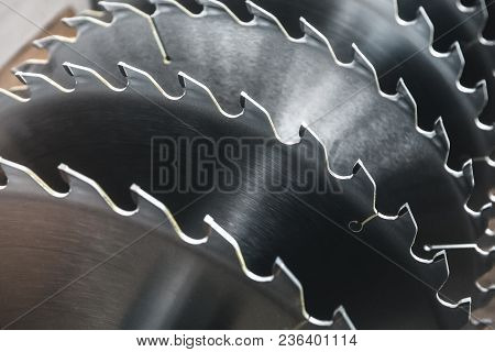 Metal Silver Circular Saw Blades For Wood Work As Industrial Tool Background, Close Up