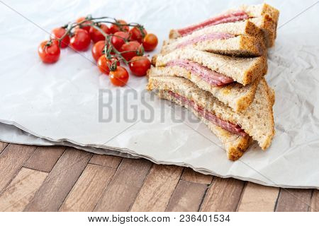Wholemeal bread sandwich topped with Lyon rosette and butter