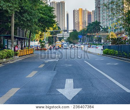 China, Shenzhen, 2018-03-09:  Close Up Empty Asphalt Road On City Street With Road Markings In The F