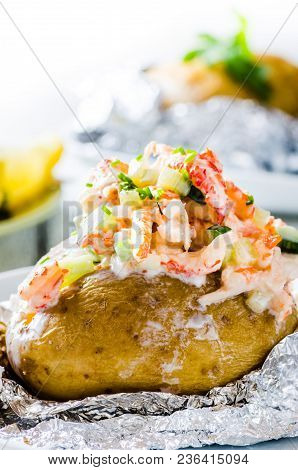Swedish Topped Backed Potato With Shrimp On Wooden Background
