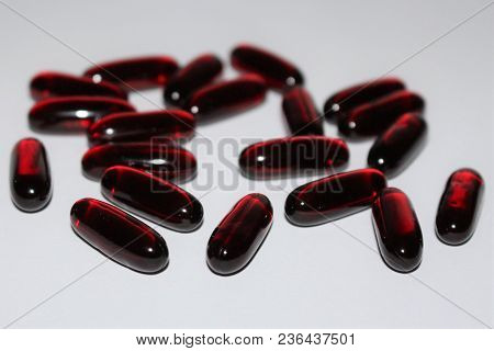 Black Cumin Oil. Black Cumin Oil Capsules Isolated On White Background. Medical Black Cumin.