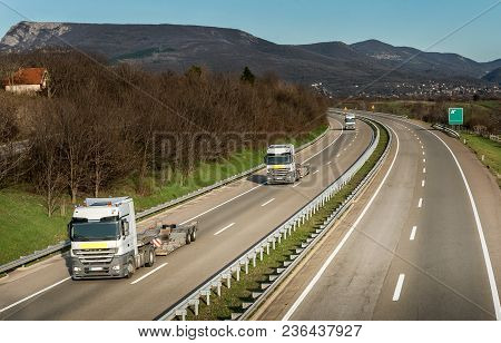Convoy Of Semi Trucks Without Trailers In Country Highway Traffic