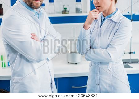 Cropped Shot On Scientists In White Coats With Arms Crossed In Lab
