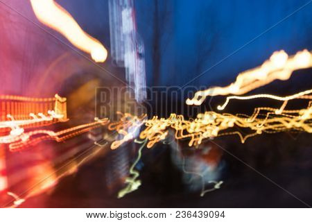 Blurred Lighhts From City Lantern, Car Headlights And Garlands Of Advertising Signs