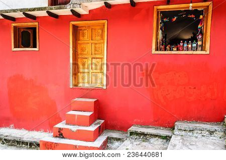 San Cristobal De Las Casas, Mexico - March 26, 2015: Red Building With Open Window Of Tienda Selling