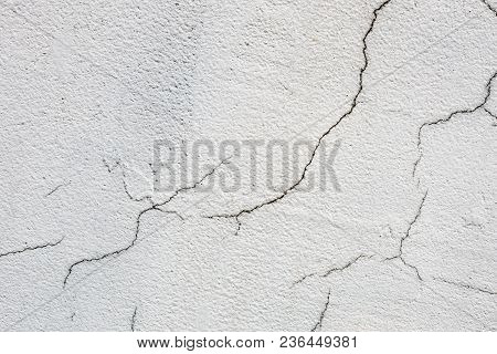 Texture Of White Dirty Cracked Wall. Small Straight Cracks. Direct Fracture On Painted Surface. Cell