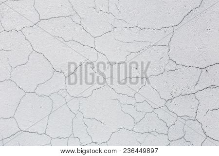 Texture Of White Dirty Cracked Wall. Small Straight Cracks. Direct Fracture On Painted Surface. Cell
