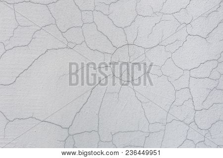 Texture Of White Dirty Cracked Wall. Small Straight Cracks. Direct Fracture On Painted Surface. Cell