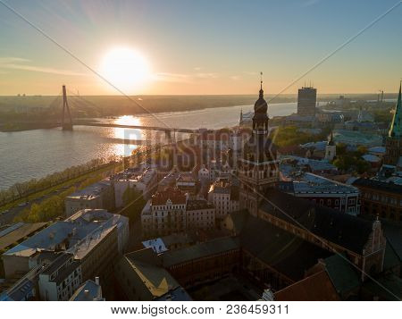 Amazing Aerial Sunset View Over Riga City In Latvia. Statue Of Liberty In The Middle Of The City - M