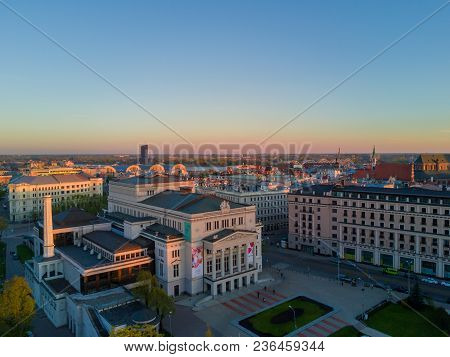 Amazing Aerial Sunset View Over Riga City In Latvia. Statue Of Liberty In The Middle Of The City - M
