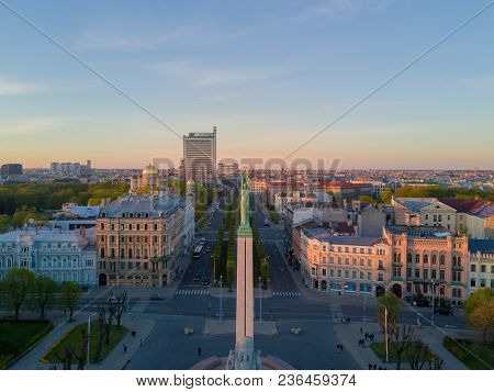 Beautiful Sunset View In Riga By The Statue Of Liberty - Milda.
