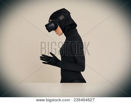 Woman Is Posing In Vr Headset. An Excited Woman Experiencing The Virtual Reality Helmet. Hi-tech Gad
