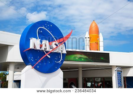Orlando, Florida/usa - April 10 2013: Kennedy Space Center Museum Nasa Sign With A Rocket On The Bac