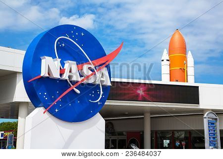 Orlando, Florida/usa - April 10 2013: Kennedy Space Center Museum Nasa Sign With A Rocket On The Bac