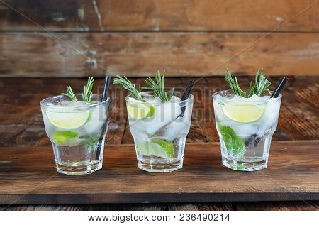 Refreshing Mint Cocktail Mojito With Rum And Lime, Cold Drink Or Beverage With Ice On Black Backgrou