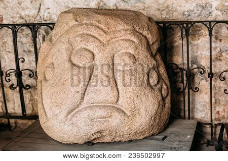 Riga, Latvia - July 2, 2016: Salaspils Stone Head Is Stone Statue Of Ancient Slavic Idol In Museum O