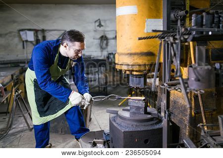 Brutal Man Forges Iron