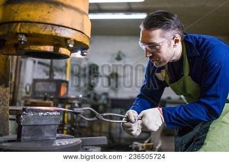 The Brutal Man Works In The Workshop