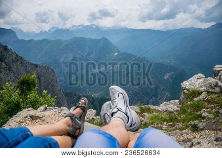 Loving Couple Resting On The Top Of The Mountain After Climbing