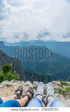Loving Couple Resting On The Top Of The Mountain After Climbing