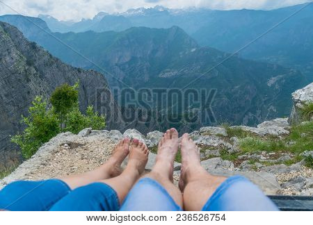 Loving Couple Resting On The Top Of The Mountain After Climbing