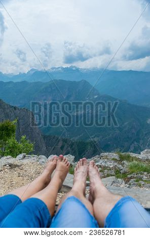 Loving Couple Resting On The Top Of The Mountain After Climbing