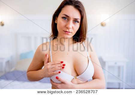 A Portrait Of A Woman Checking Her Breast